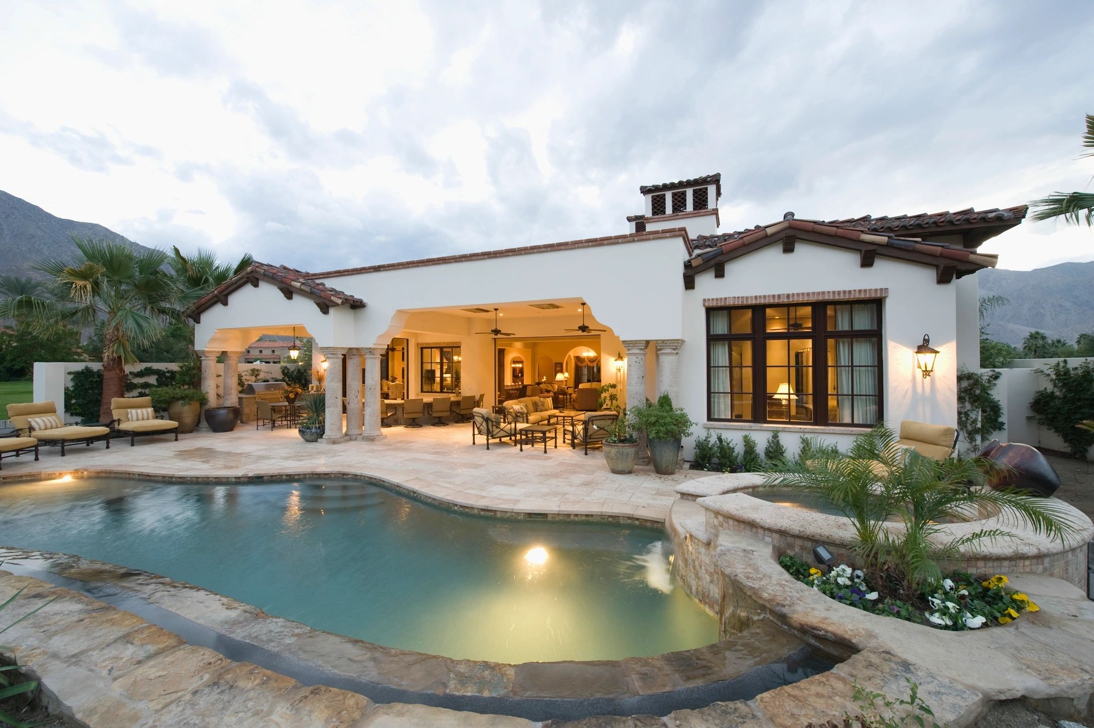 Spanish Colonial villa with pool at dusk
